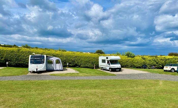 Stunning all-weather serviced pitches suitable for tents, touring caravans and motorhomes